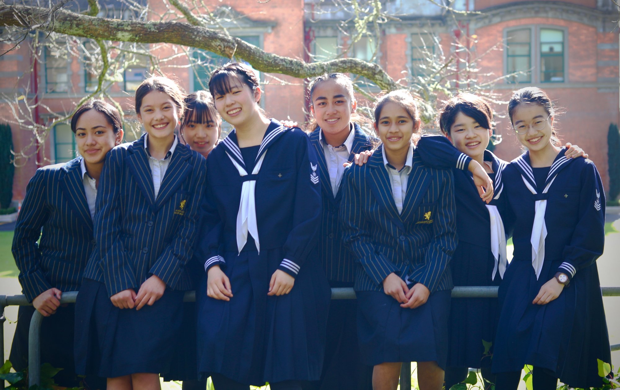 AGGS 2023 AGGS and Japanese girls group shot to camera in front of building 